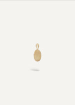 Side view of 9 k gold engraveable oval charm pendant from sb studio yeg.