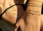 gold permanent jewelry in edmonton at sb studio