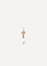 Solid 14k engravable key pendant on a white background from sb studio yeg