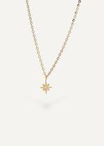 SB Studio 14k yellow gold North Star pendant necklace featuring a small central diamond on a cable chain.