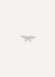 Silver bow-shaped charm on a white background