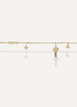 Gold bracelet with 'MAMA' and star, key, and heart charms on a white background from sb studio formerly the sparkle bar