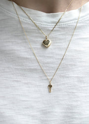 key and heart locket made of solid gold by sb studio