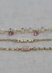 solid 14k bracelets from the sparkle bar with mama charm and sapphire gemstones