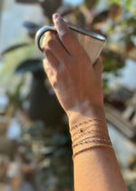 charm bracelets and paperclip chain bracelet at sb studio in alberta