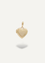 Gold heart-locket pendant on a white background