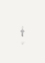 Silver engravable key pendant on a white background from the sb studio yeg