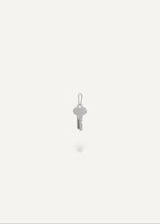 Silver engravable key pendant on a white background from the sb studio yeg