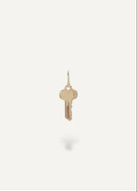 Solid 14k Gold key pendant on a white background from sb studio in canada