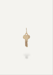 Solid 14k Gold key pendant on a white background from sb studio in canada