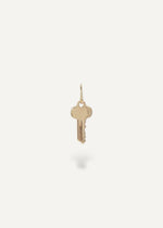 Solid 14k Gold key pendant on a white background from sb studio in canada