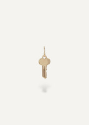 Solid 14k Gold key pendant on a white background from sb studio in canada