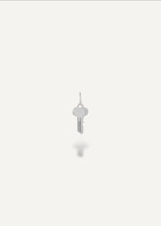 Silver engravable key pendant on a white background from sb studio yeg