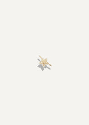 SB Studio Fleur charm bracelet featuring a delicate gold flower pendant with sparkling white topaz gemstone accents.