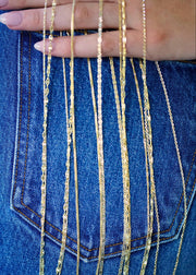 SB Studio Aniya bi-colour 10k yellow and white gold cable chain necklace with a sparkly finish on denim