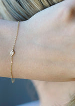 Solid 14k gold diamond evil eye charm bracelet from SB Studio in Edmonton