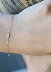 Solid 14k gold diamond evil eye charm bracelet from SB Studio in Edmonton