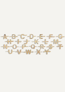 The Sparkle Bar 14k yellow gold alphabet letter charms for a custom bracelet, featuring A-Z letters.
