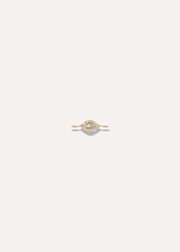 SB Studio golden eye charm bracelet featuring a delicate gold chain and a central eye motif with small diamonds.