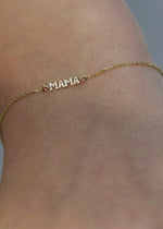 SB Studio Mama gold charm bracelet featuring a delicate 14k gold cable chain on a wrist.