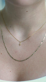 SB Studio Penelope necklace featuring a delicate gold chain with a small star pendant layered with a flat chain.
