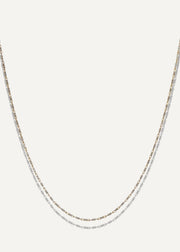 SB studio Pixie necklace featuring a delicate 1.1mm bi-colour diamond-cut raso chain in 10k yellow and white gold