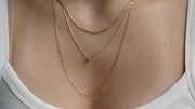 sb studio Pixie Necklace featuring a delicate 10k yellow and white gold bi-colour diamond-cut raso chain.