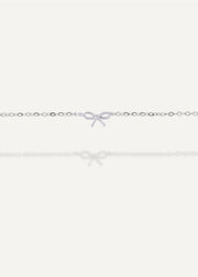 Sb studio sterling silver bow charm bracelet on a delicate diamond-cut cable chain.