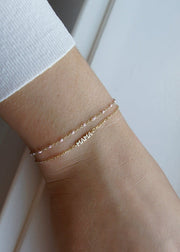 solid 14k Gold 'MAMA' charm on a diamond cut cable chain bracelet from sb studio in edmonton