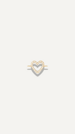 The Sparkle Bar dainty 14k gold bow charm on a delicate cable chain bracelet for everyday minimalist jewelry wear.