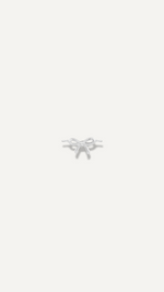 The Sparkle Bar dainty gold bow charm for a bracelet, featuring a minimalist design for everyday wear.