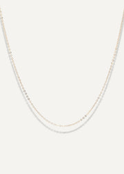 The Sparkle Bar Mariam gold necklace featuring a delicate 1mm diamond-cut cable chain for everyday wear.